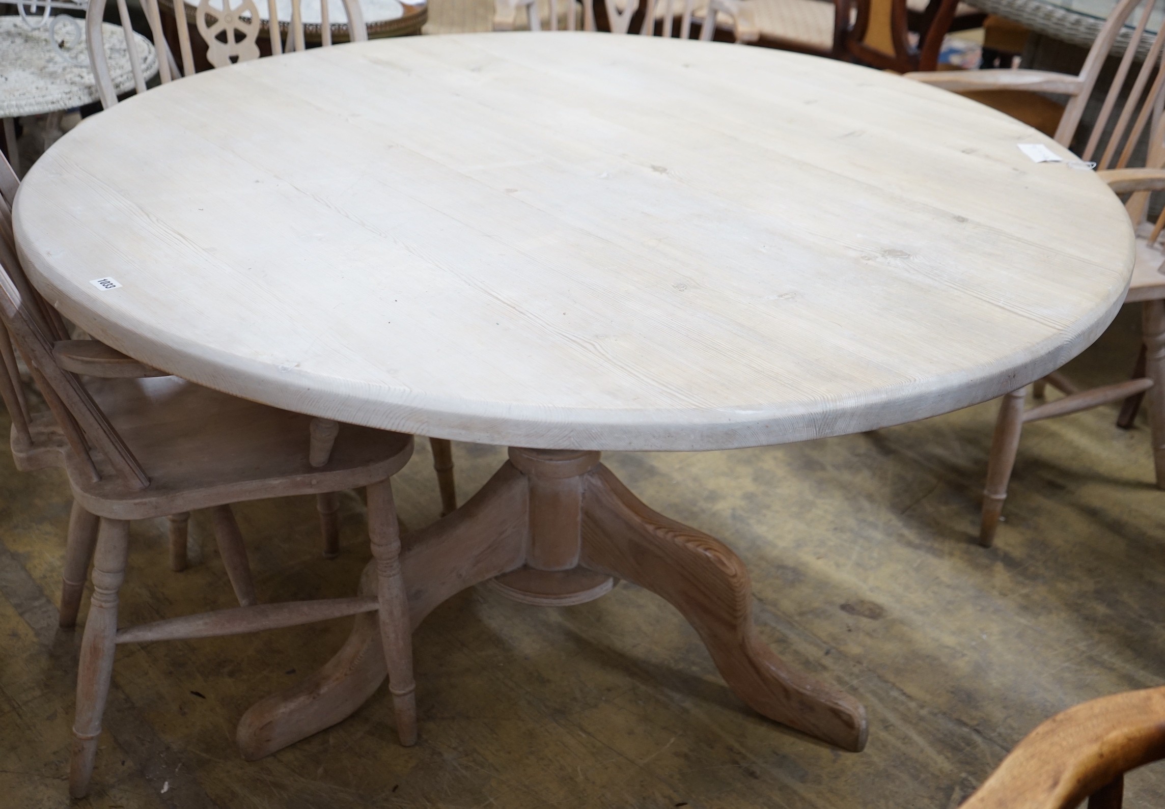 A Victorian style pine circular dining table, diameter 134cm, height 79cm